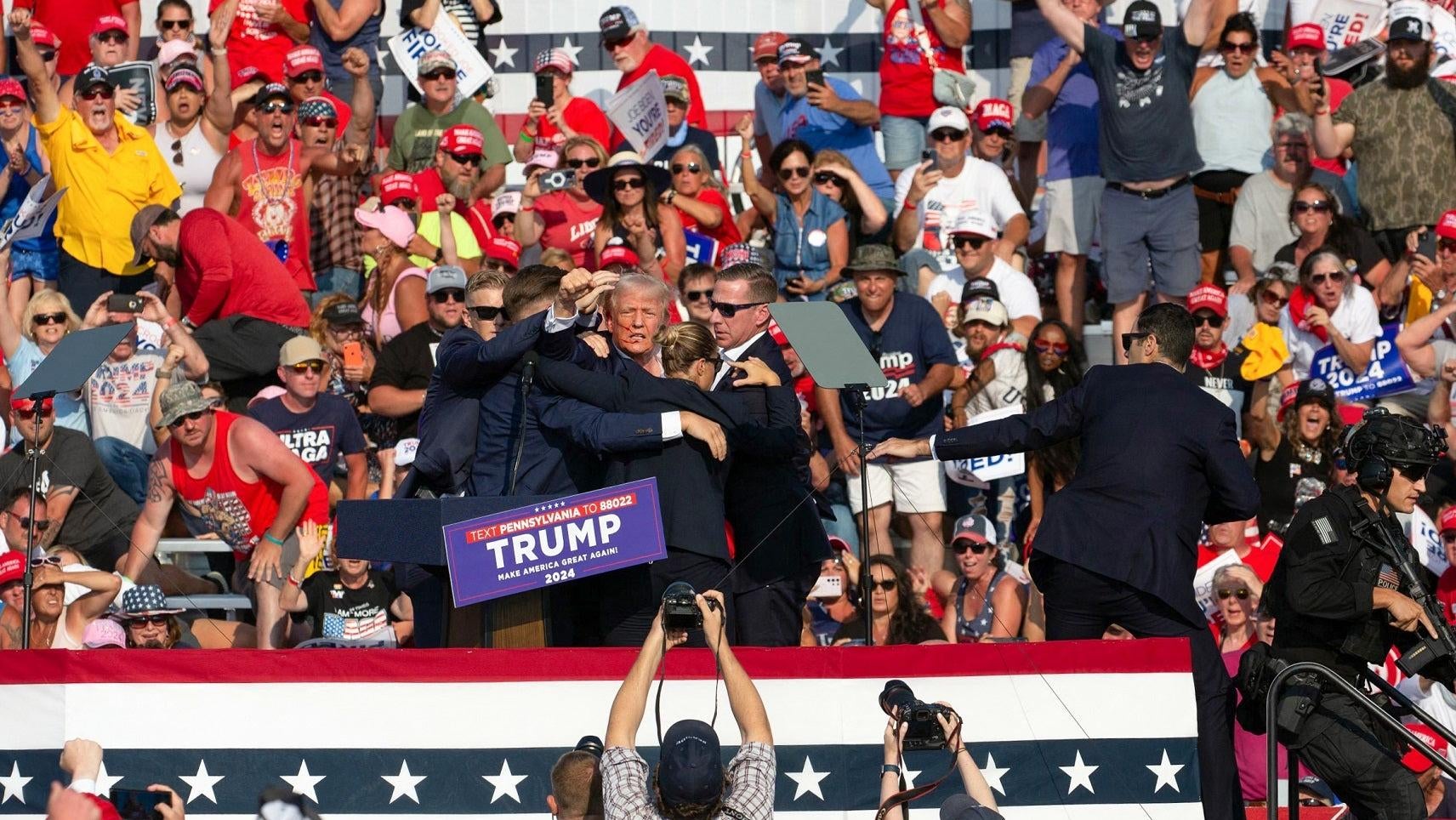 Former President Trump raised his fist after being injured in an alleged assassination attempt. 